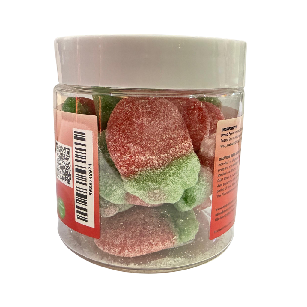 Jar of red and green gummy candies with a white lid on a white background